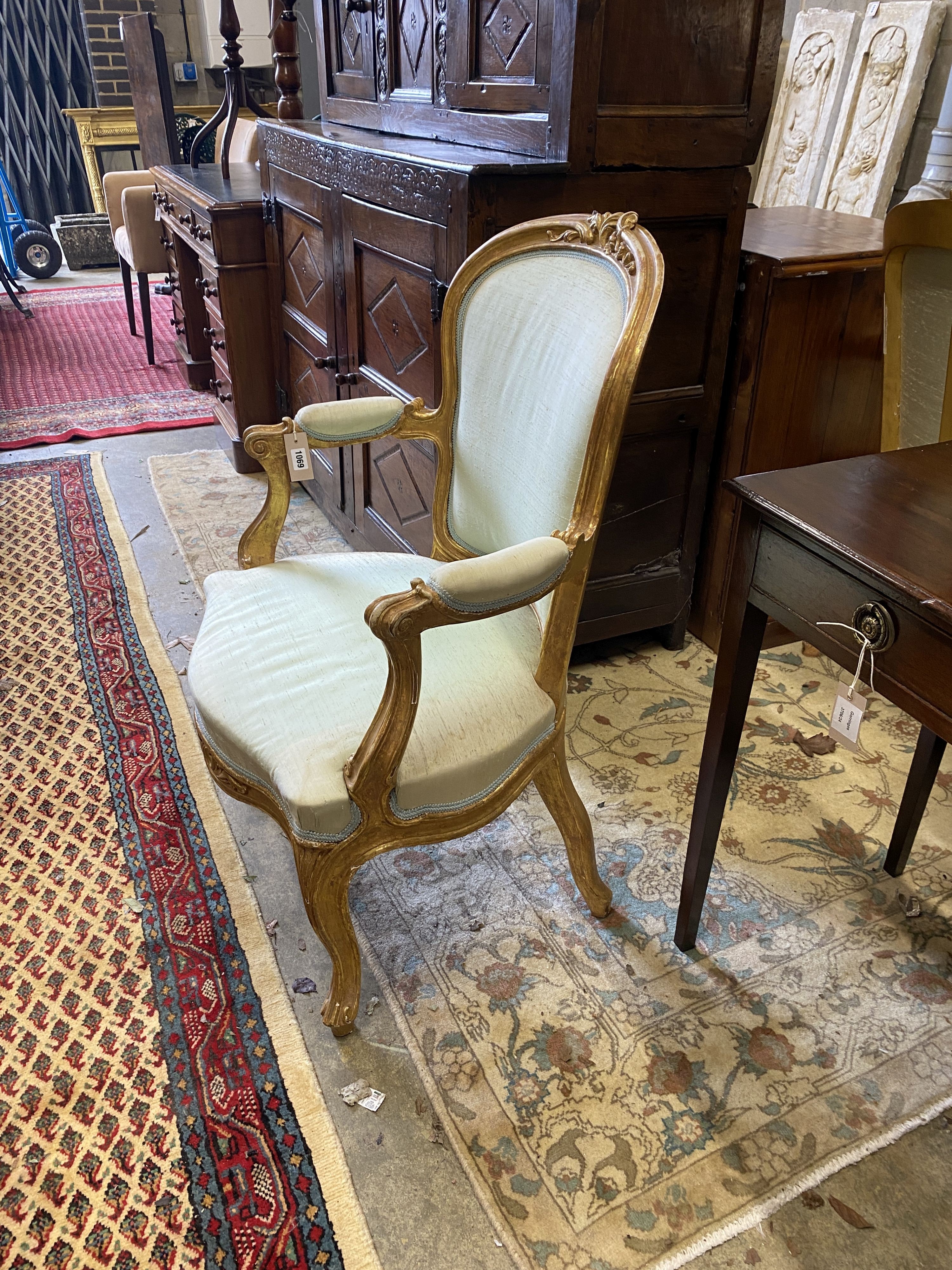 A pair of 19th century Louis XV design carved giltwood fauteuils, width 64cm, depth 50cm, height 94cm